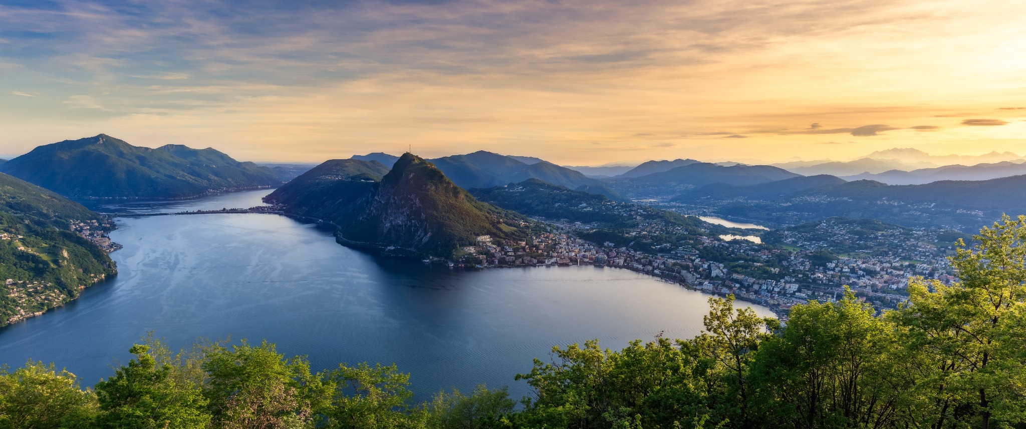 Panoramic view over Lake Lugano at sunset